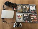 Playstation 2 grijs + kabels en spellen