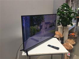(102) Flatscreen tv Neufunk met afstandsbediening