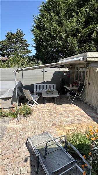 Grote foto zonneluifel omnistore tuin en terras zonneschermen