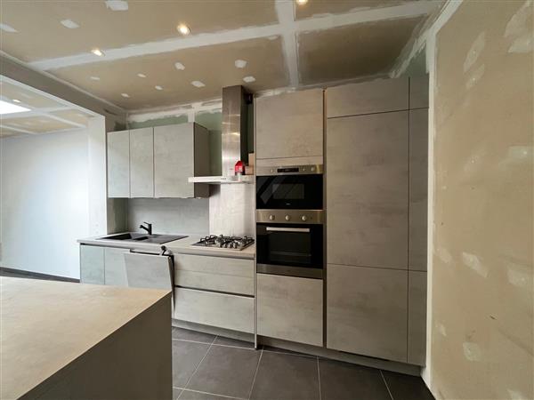 Grote foto betonlookkeuken met eiland. huis en inrichting keukens