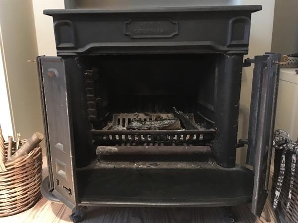 Grote foto antieke houtkachel godin colonial doe het zelf en verbouw verwarming radiatoren