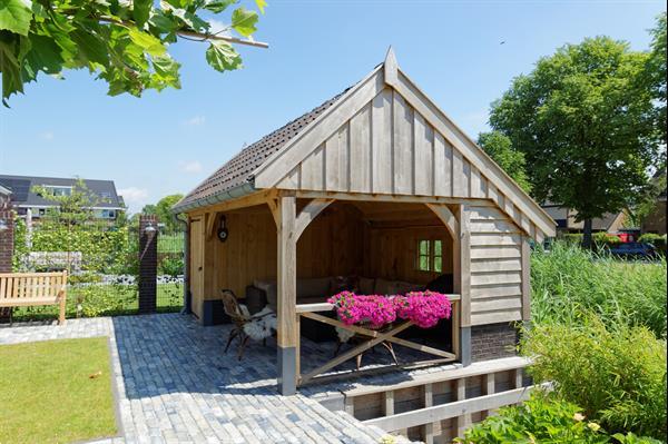 Grote foto eikenhouten kapschuur met tuinkamer tuin en terras tuinhuisjes en blokhutten