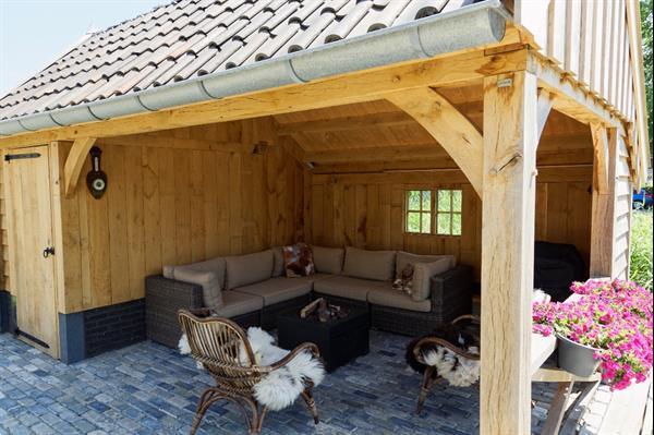 Grote foto eikenhouten kapschuur met tuinkamer tuin en terras tuinhuisjes en blokhutten