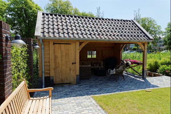 Grote foto eikenhouten kapschuur met tuinkamer tuin en terras tuinhuisjes en blokhutten