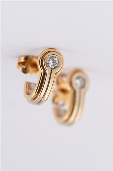 Grote foto wit geel gouden oorstekers met in elk een briljant kleding dames sieraden